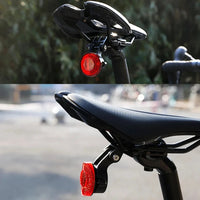 Black round bike rear reflector light with seatpost mount