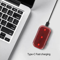 Red rear bike light with three LED points