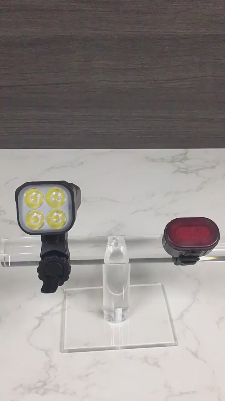 Black bike light set with front multi-lens headlight and rear light